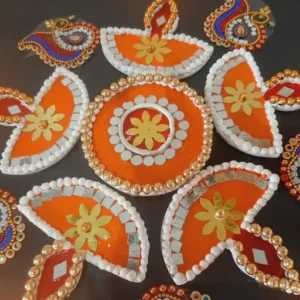 Diwali Rangoli designs, Diwali decoration ideas, Orange-themed Rangoli, Diwali festival art, Traditional Indian Rangoli, Vibrant Diwali decor, Festive Rangoli patterns, Orange color symbolism, Diwali celebration traditions, Bright Rangoli colors,