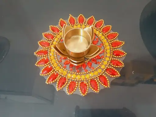 Diya Base Rangoli, Single Piece Rangoli, Gold and Red Rangoli Design, Traditional Rangoli Patterns, Festive Home Decor, Diwali Decoration Ideas, Indian Rangoli Designs, Diya Rangoli Patterns, Decorative Rangoli Art, Vibrant Rangoli Decor,