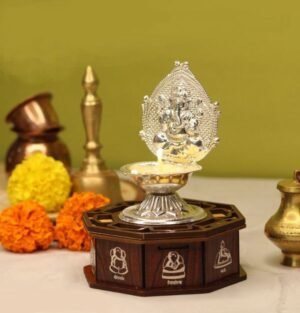 Solar Silver Ganpati Diya, Silver Ganpati Diya with solar light, Solar-powered Ganesh diya, Traditional Solar Silver Ganpati Lamp, Eco-friendly Silver Ganpati Diya, Rechargeable Solar Ganpati Deepam, Solar Ganpati Diya for pooja, LED Solar Silver Ganesh Deepam, Decorative Solar Silver Ganpati Lamp, Antique Silver Diya with solar light, Solar pooja lamp with Ganpati design, Handcrafted Solar Silver Ganesh Diya, Ethnic Silver Diya with solar technology, Solar Silver Deepam for temple decor, Ganpati Bappa Diya with solar lighting, Silver Ganesh lamp with rechargeable solar power, Sustainable Ganpati Deepam for religious use, Solar-powered temple diya for puja rituals, Traditional Silver Diya with LED solar lighting, Handcrafted Ganesh pooja diya with solar energy,