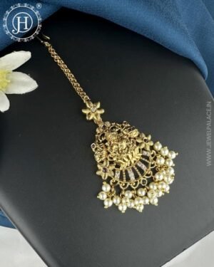 Antique gold premium tikka featuring intricate designs and detailed embellishments, perfect for adding a touch of elegance and tradition to any outfit or occasion