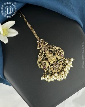Antique gold premium tikka with intricate detailing and embellishments, designed to add a traditional and elegant touch to any outfit or occasion