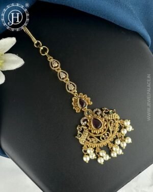 Antique gold premium tikka with intricate designs and detailed embellishments, adding a traditional and elegant touch to any hairstyle or outfit.