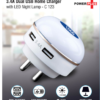 Dual USB Home Charger with LED Night Lamp on a bedside table charging two devices