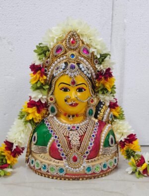 Decorated fiber Varalakshmi face idol with colorful traditional jewelry and crown